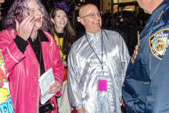 The 2021 New York Halloween Parade took off again this year after one year off due to COVID. 
Jeanne Fleming, parade master and Jason Feldman, who made a generous donation for the production of the parade this year, have a good laugh with police.
This spooktakular event started in the West Village on Spring St and followed down 6th Ave where performers, floats and a diverse set of costumes marched down for spectators.
Hundreds gathered together again to enjoy this iconic event. (C) Bianca Otero. October 31, 2021. NYC