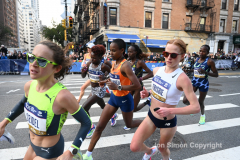 The running of the 50th Anniversary of the New York City Marathon 11/7/21. Thirty thousand runners took to the streets of the 5 boroughs, down from the fifty thousand pre covid. The joy on the faces reflects the end of a long year of covid restrictions.  Copyright Jon Simon .