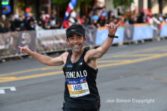 The running of the 50th Anniversary of the New York City Marathon 11/7/21. Thirty thousand runners took to the streets of the 5 boroughs, down from the fifty thousand pre covid. The joy on the faces reflects the end of a long year of covid restrictions.  Copyright Jon Simon .