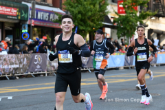 The running of the 50th Anniversary of the New York City Marathon 11/7/21. Thirty thousand runners took to the streets of the 5 boroughs, down from the fifty thousand pre covid. The joy on the faces reflects the end of a long year of covid restrictions.  Copyright Jon Simon .