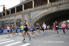 The running of the 50th Anniversary of the New York City Marathon 11/7/21. Thirty thousand runners took to the streets of the 5 boroughs, down from the fifty thousand pre covid. The joy on the faces reflects the end of a long year of covid restrictions.  Copyright Jon Simon .