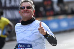 The running of the 50th Anniversary of the New York City Marathon 11/7/21. Thirty thousand runners took to the streets of the 5 boroughs, down from the fifty thousand pre covid. The joy on the faces reflects the end of a long year of covid restrictions.  Copyright Jon Simon .
