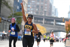 The running of the 50th Anniversary of the New York City Marathon 11/7/21. Thirty thousand runners took to the streets of the 5 boroughs, down from the fifty thousand pre covid. The joy on the faces reflects the end of a long year of covid restrictions.  Copyright Jon Simon .