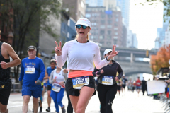 The running of the 50th Anniversary of the New York City Marathon 11/7/21. Thirty thousand runners took to the streets of the 5 boroughs, down from the fifty thousand pre covid. The joy on the faces reflects the end of a long year of covid restrictions.  Copyright Jon Simon .