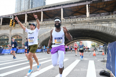 The running of the 50th Anniversary of the New York City Marathon 11/7/21. Thirty thousand runners took to the streets of the 5 boroughs, down from the fifty thousand pre covid. The joy on the faces reflects the end of a long year of covid restrictions.  Copyright Jon Simon .