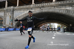The running of the 50th Anniversary of the New York City Marathon 11/7/21. Thirty thousand runners took to the streets of the 5 boroughs, down from the fifty thousand pre covid. The joy on the faces reflects the end of a long year of covid restrictions.  Copyright Jon Simon .