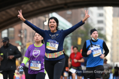 The running of the 50th Anniversary of the New York City Marathon 11/7/21. Thirty thousand runners took to the streets of the 5 boroughs, down from the fifty thousand pre covid. The joy on the faces reflects the end of a long year of covid restrictions.  Copyright Jon Simon .