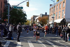 Even though he's 15 miles from the finish line this runner is still excited to be part of the New York City Marathon.