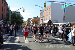 A group of top level male runners make their way through Brooklyn.