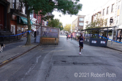 In previous years Brooklyn's Bedford Avenue was cleared from curb to curb but some restaurant "outdoor dining structures" restricted the space available for runners.