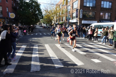 Another group of runners the Marathon organizers classify as "pro men" speed through Brooklyn.