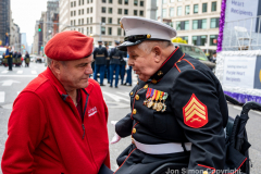 NYC Veterans Day Parade offers up a variety of people, both marchers and spectators 11/11/21.  Curtis Sliwa talks with a Purple Heart recipient.