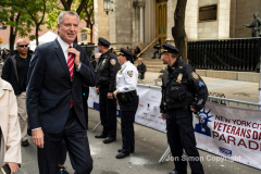NYC Veterans Day Parade offers up a variety of people, both marchers and spectators 11/11/21.  NYC Mayor De Blasio attends the Veterans Parade.