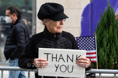 A woman holds a "Thank You" sign as New Yorkers line the street along 5th Avenue for the 102nd Veterans Day Parade in New York, New York, on Nov. 11, 2021. (Photo by Gabriele Holtermann/Sipa USA)