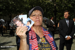 New York, 9.11 20th Anniversary Ceremony held at Ground Zero. Families and Friends gather to hear the names of the victims of the World Trade Center Attack. Families place flowers and photographs on the names of the victims.