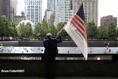 New York, 9.11 20th Anniversary Ceremony held at Ground Zero. Families and Friends gather to hear the names of the victims of the World Trade Center Attack. Families place flowers and photographs on the names of the victims.