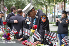 New York, 9.11 20th Anniversary Ceremony held at Ground Zero. Families and Friends gather to hear the names of the victims of the World Trade Center Attack. Families place flowers and photographs on the names of the victims.
