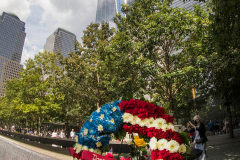 NEW YORK, NEW YORK - SEPTEMBER 11: Flowers are placed into the inscribed names of the victims of the 9/11 attacks and in the 1993 World Trade Center bombing during the annual commemoration ceremony at the National 9/11 Memorial and Museum on September 11, 2021 in New York City. The nation is marking the 20th anniversary of the terror attacks of September 11, 2001, when the terrorist group al-Qaeda flew hijacked airplanes into the World Trade Center, Shanksville, PA and the Pentagon, killing nearly 3,000 people