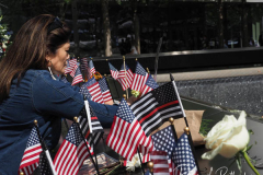 NEW YORK, NEW YORK - SEPTEMBER 11: Flags and flowers adorn the names of the victims of the attacks of Sept. 11, 2001, during a ceremony at the 9/11 Memorial and Museum on September 11, 2021 in New York City. The nation is marking the 20th anniversary of the terror attacks of September 11, 2001, when the terrorist group al-Qaeda flew hijacked airplanes into the World Trade Center, Shanksville, PA and the Pentagon, killing nearly 3,000 people.