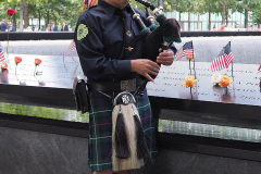 NEW YORK, NEW YORK - SEPTEMBER 11: A member of the Jersey City, NJ Fire Department plays the bagpipes at the annual 9/11 Commemoration Ceremony at the National 9/11 Memorial and Museum on September 11, 2021 in New York City.