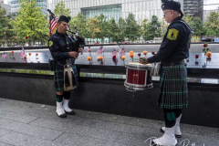 NEW YORK, NEW YORK - SEPTEMBER 11: A member of the Jersey City, NJ Fire Department plays the bagpipes at the annual 9/11 Commemoration Ceremony at the National 9/11 Memorial and Museum on September 11, 2021 in New York City.
