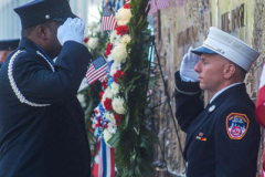 Two Firemen salute each other before relieving the other from duty in front of the FDNY Ten House, located just blocks away from  One World Trade Center in NYC. Thousands of people came to pay their respects and to remember the tragedy that befell NYC 20 years ago. 

An array of events were scheduled throughout NYC to honor and remember the catastrophe that shook the world in 2001. September 11, 2021 (C)Bianca Otero