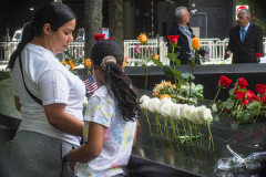 A woman and her daughter stand at the 9/11 Memorial South Pool after a memorial held for family, friends and citizens who lost family and were affected by the tragic event of 9/11 that shook NYC and the world. Hundreds of people attended the public event, in which President Joe Biden and First Lady, Jill Biden attended, to commemorate and honor those lost. September 11, 2021 (C) Bianca Otero
