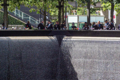 People at the 9/11 Memorial South Pool after a memorial held for family, friends and citizens who lost family and were affected by the tragic event of 9/11 that shook NYC and the world. Hundreds of people attended the public event, in which President Joe Biden and First Lady, Jill Biden attended, to commemorate and honor those lost. September 11, 2021 (C) Bianca Otero