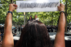 A woman stands holding a pencil rubbing of her beloved  who passed in the 9/11 attacks at the 20 year anniversary ceremony that took place at One World Center.

Hundreds of people came to the memorial to pay tribute to their family members and loved ones marking the 20th anniversary of the tragedy that struck NYC and shocked the world on 9/11/01. (C) Bianca Otero