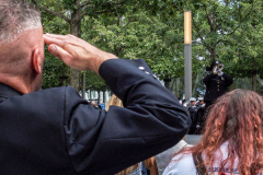 A man plays TAPS while others stand in salute to those who were lost, who faught and who worked hard due to the tragic attack on the Twin Towers 20 years ago on 9/11.

Hundreds of people came to the memorial to pay tribute to their family members and loved ones marking the 20th anniversary of the tragedy that struck NYC and shocked the world on 9/11/01. (C) Bianca Otero