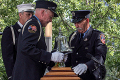 Three officers take the liberty bell from the podium after the commemoration of the 20th anniversary of 9/11 attacks.
 
Hundreds of people came to the memorial to pay tribute to their family members and loved ones marking the 20th anniversary of the tragedy that struck NYC and shocked the world on 9/11/01. (C) Bianca Otero