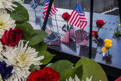 A detail of flowers, flags and messages at the South Pool of the 9/11 memorial. 
Hundreds of people came to the memorial to pay tribute to their family members and loved ones marking the 20th anniversary of the tragedy that struck NYC and shocked the world on 9/11/01. (C) Bianca Otero