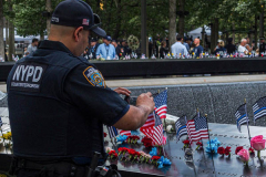 A counterterroism officer pays tribute and takes a photo of a lost colleague at the South Mirror Pool at the 9/11 memorial site.
Hundreds of people came to the memorial to pay tribute to their family members and loved ones marking the 20th anniversary of the tragedy that struck NYC and shocked the world on 9/11/01. (C) Bianca Otero