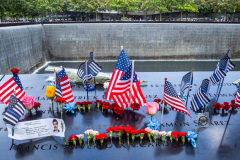 A detail of flowers, flags and messages at the South Pool of the 9/11 memorial. 
Hundreds of people came to the memorial to pay tribute to their family members and loved ones marking the 20th anniversary of the tragedy that struck NYC and shocked the world on 9/11/01. (C) Bianca Otero