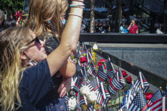 A woman and her daughter stand at the place of their lost family member at the South Pool of the 9/11 memorial. 
Hundreds of people came to the memorial to pay tribute to their family members and loved ones marking the 20th anniversary of the tragedy that struck NYC and shocked the world on 9/11/01. (C) Bianca Otero