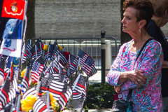 A woman lost in thought, stands at the place of  her lost family member at the South Pool of the 9/11 memorial. 
Hundreds of people came to the memorial to pay tribute to their family members and loved ones marking the 20th anniversary of the tragedy that struck NYC and shocked the world on 9/11/01. (C) Bianca Otero