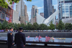 Two men make a tribute to a colleague lost during the 9/11 attack at the North Pool of the 9/11 memorial. 
Hundreds of people came to the memorial to pay tribute to their family members and loved ones marking the 20th anniversary of the tragedy that struck NYC and shocked the world on 9/11/01. (C) Bianca Otero