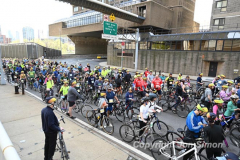 The annual NYC Five Boro Bike Tour exits the FDR Drive and passes through the Upper East Side of Manhattan as it heads to Queens 5/1/22.   Always held on the first Sunday of May, the 40 mile tour has over 30,000 participants. Copyright Jon Simon