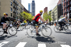 The annual NYC Five Boro Bike Tour exits the FDR Drive and passes through the Upper East Side of Manhattan as it heads to Queens 5/1/22.   Always held on the first Sunday of May, the 40 mile tour has over 30,000 participants. Copyright Jon Simon
