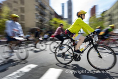 The annual NYC Five Boro Bike Tour exits the FDR Drive and passes through the Upper East Side of Manhattan as it heads to Queens 5/1/22.   Always held on the first Sunday of May, the 40 mile tour has over 30,000 participants. Copyright Jon Simon