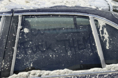 September 12, 2001--World Trade Center--A Port Authority Police car covered with dust and debris from the rubble of the destroyed World Trade Center has a message written on its windows September 12, 2001. (©2001 Kevin P. Coughlin/Independent Photojournalist)