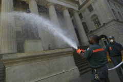 September 13, 2001--World Trade Center--NYC Sanitation workers hose debris off of the statue of George Washington on the steps of Federal Hall in Lower Manhattan on Thursday  September 13, 2001. (©2001 Kevin P. Coughlin/Independent Photojournalist)