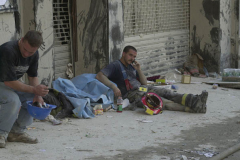 September 13, 2001--World Trade Center--A firefighter talks on a cell phone on a sidewalk adjacent to the World Trade Center after terrorist attacks destroyed the complex two days earlier on Tuesday September 11, 2001. (©2001 Kevin P. Coughlin/Independent Photojournalist)