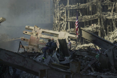 September 13, 2001--World Trade Center--The flag of the United States stands as firefighters search for survivors in Lower Manhattan at Ground Zero of the destroyed World Trade Center after terrorist attacks two days earlier on Tuesday September 11, 2001. (©2001 Kevin P. Coughlin/Independent Photojournalist)