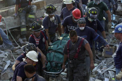 September 13, 2001--World Trade Center--A body is recovered Wednesday afternoon 9-13-01 from Ground Zero from the rubble of the destroyed World Trade Center after terrorist attacks two days earlier on Tuesday September 11, 2001. (©2001 Kevin P. Coughlin/Independent Photojournalist)