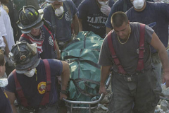 September 13, 2001--World Trade Center--A body is recovered Wednesday afternoon 9-13-01 from Ground Zero from the rubble of the destroyed World Trade Center after terrorist attacks two days earlier on Tuesday September 11, 2001. (©2001 Kevin P. Coughlin/Independent Photojournalist)