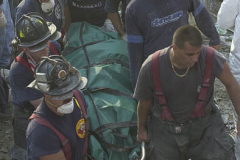 September 13, 2001--World Trade Center--A body is recovered Wednesday afternoon 9-13-01 from Ground Zero from the rubble of the destroyed World Trade Center after terrorist attacks two days earlier on Tuesday September 11, 2001. (©2001 Kevin P. Coughlin/Independent Photojournalist)