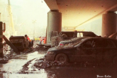 New York, Ground Zero 9/11/2001 
Aftermath of the attack on the World Trade Center. Workers searching the pile for survivors, Damaged Fire Trucks and Police vehicles