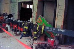 New York, Ground Zero 9/11/2001 
Aftermath of the attack on the World Trade Center. Workers searching the pile for survivors, Damaged Fire Trucks and Police vehicles