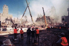 New York, Ground Zero 9/11/2001 
Aftermath of the attack on the World Trade Center. Workers searching the pile for survivors, Damaged Fire Trucks and Police vehicles